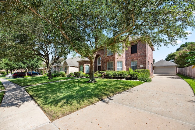 view of front of property with a garage and a front lawn