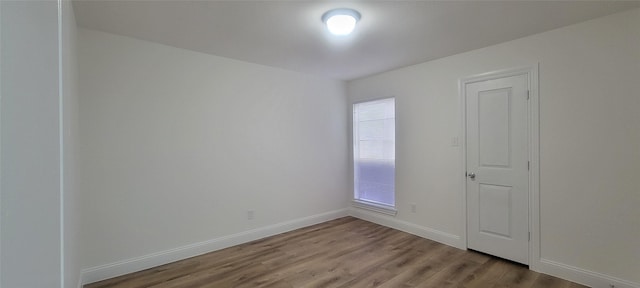 empty room with light hardwood / wood-style floors