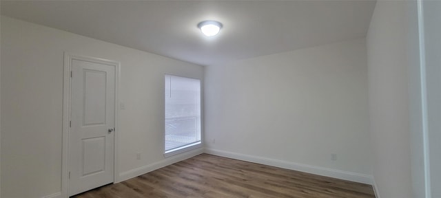 unfurnished room with light hardwood / wood-style flooring