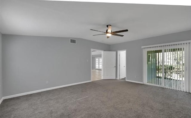 carpeted spare room with plenty of natural light, ceiling fan, and lofted ceiling