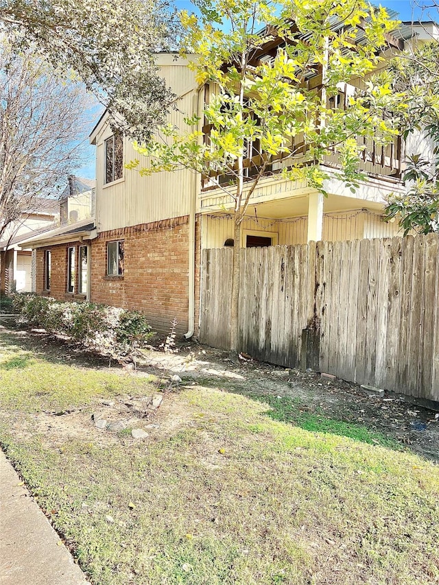 7854 Green Lawn Dr Unit 7854, Houston, TX 77088 - view of side of home with brick siding