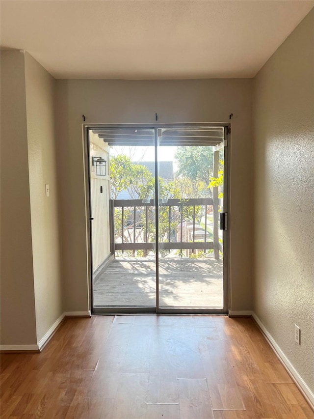 unfurnished room featuring light wood-type flooring