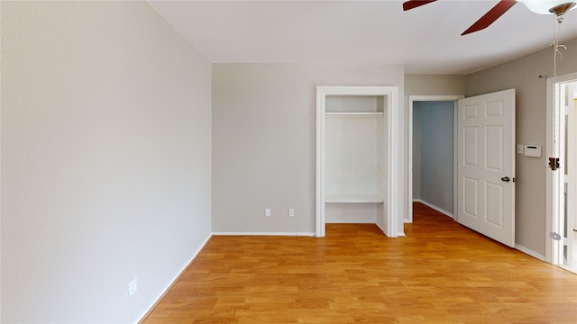 unfurnished bedroom featuring ceiling fan and light hardwood / wood-style flooring