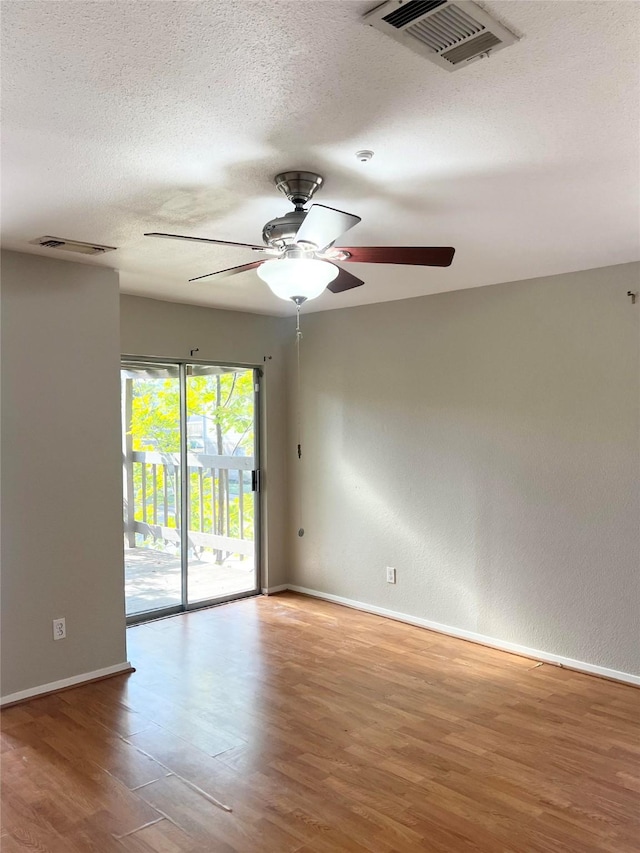 7854 Green Lawn Dr Unit 7854, Houston, TX 77088 - spare room featuring ceiling fan, wood finished floors, and a textured ceiling