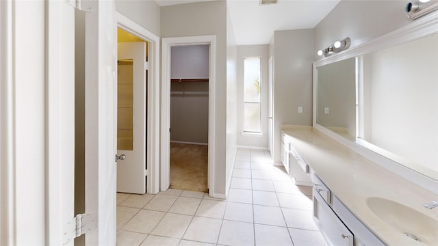 7854 Green Lawn Dr Unit 7854, Houston, TX 77088 - bathroom with double vanity, tile patterned flooring, and a spacious closet