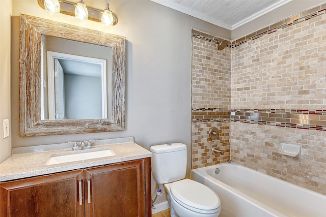 full bathroom with vanity, toilet, tiled shower / bath, and ornamental molding