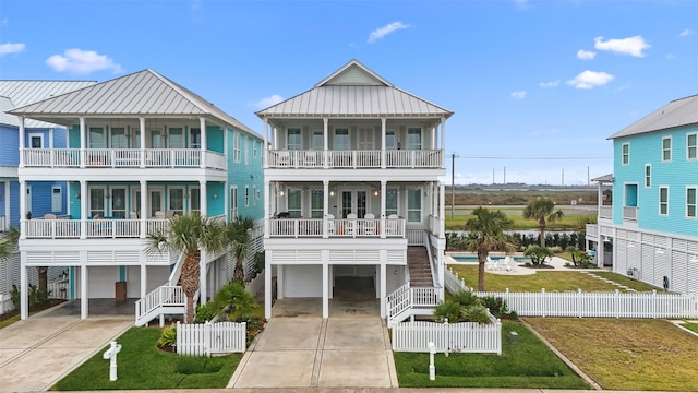 beach home with a front lawn and a carport