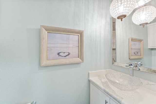 bathroom featuring vanity and an inviting chandelier