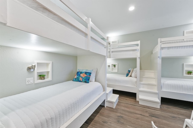 bedroom with recessed lighting, visible vents, and wood finished floors