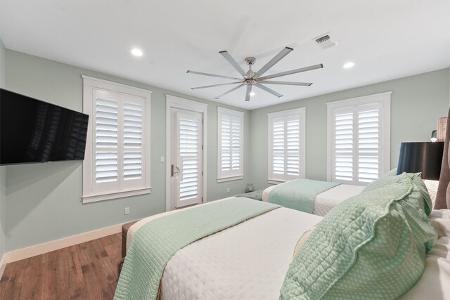 bedroom with hardwood / wood-style floors and ceiling fan