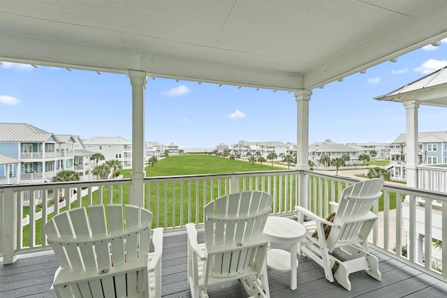 deck featuring a yard and a residential view