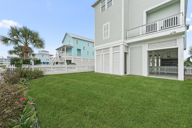 view of yard with a balcony