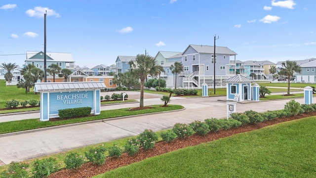 surrounding community featuring a residential view and a lawn