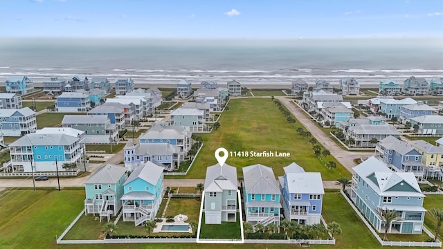 birds eye view of property with a water view and a residential view