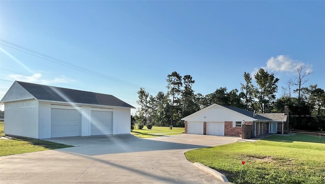 garage featuring a lawn