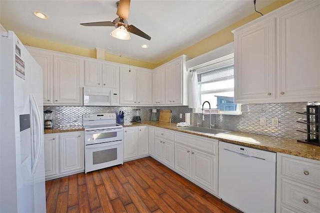 kitchen with white cabinets, white appliances, sink, and tasteful backsplash