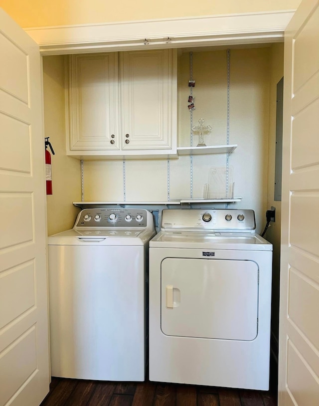 washroom with cabinets, independent washer and dryer, and dark hardwood / wood-style floors