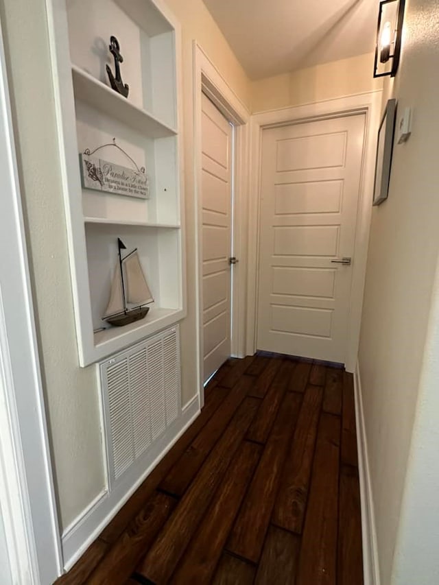 corridor with dark wood-type flooring