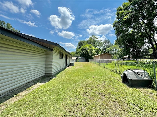 view of yard with central AC unit