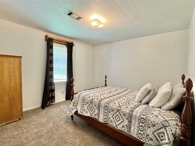 carpeted bedroom with a textured ceiling