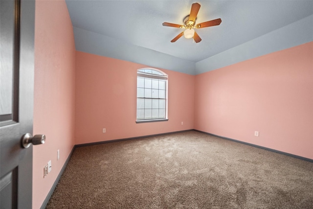 carpeted empty room featuring ceiling fan