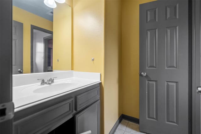 bathroom with tile patterned flooring and vanity