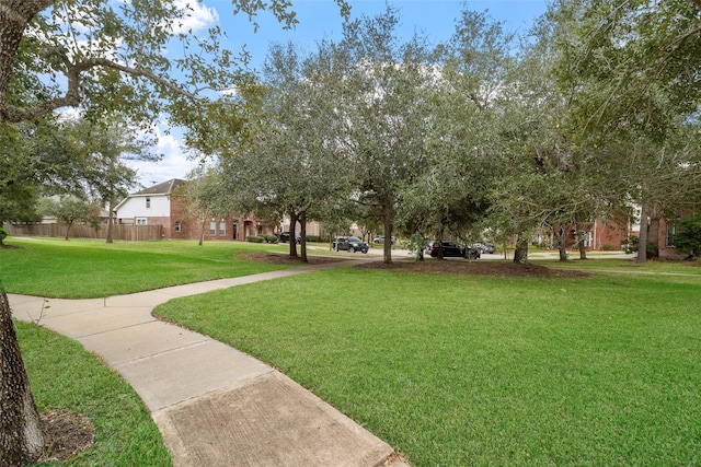 view of home's community with a yard