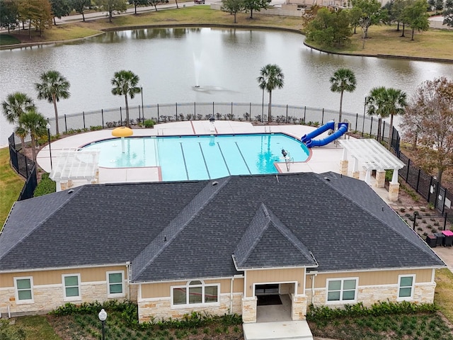 view of swimming pool with a water view