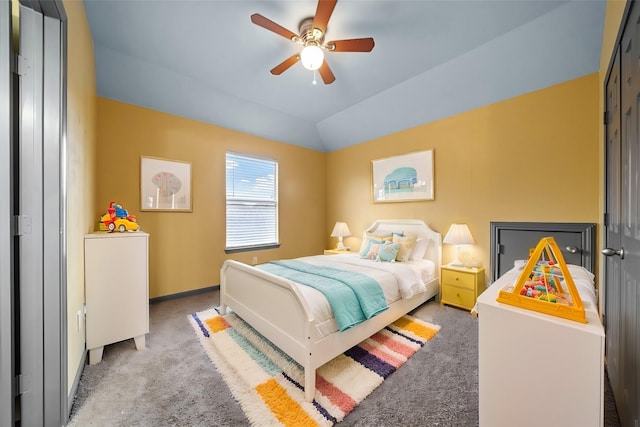 carpeted bedroom featuring ceiling fan and lofted ceiling