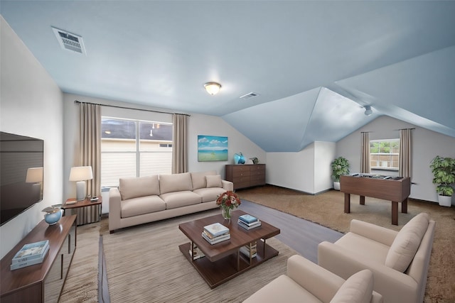 living room with light carpet and lofted ceiling