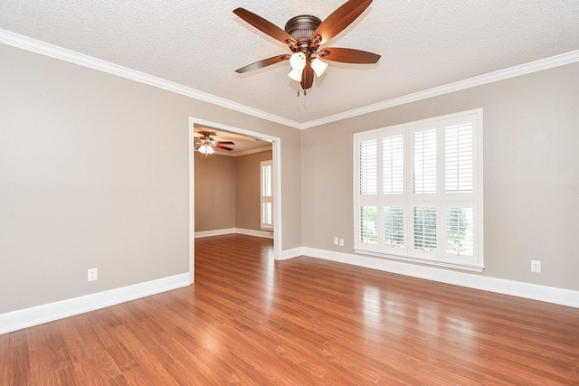 spare room featuring ceiling fan, crown molding, light hardwood / wood-style flooring, and a textured ceiling