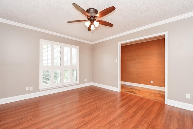 empty room with ceiling fan, crown molding, a textured ceiling, and light wood-type flooring