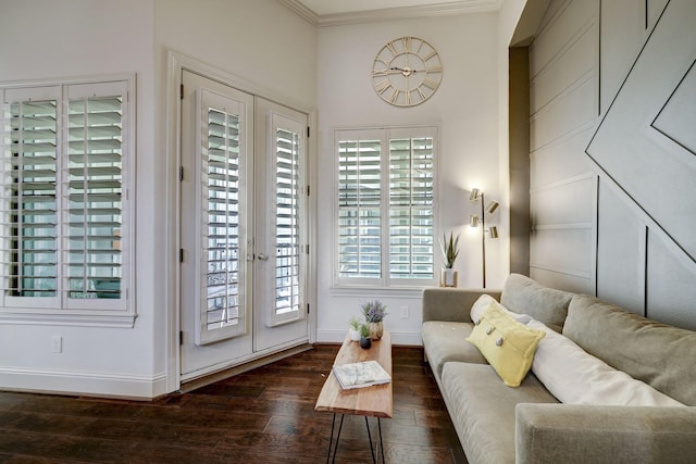 living room with french doors, crown molding, and dark wood-type flooring