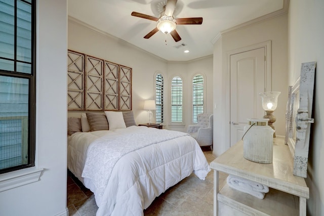 bedroom featuring tile patterned flooring, ceiling fan, and crown molding