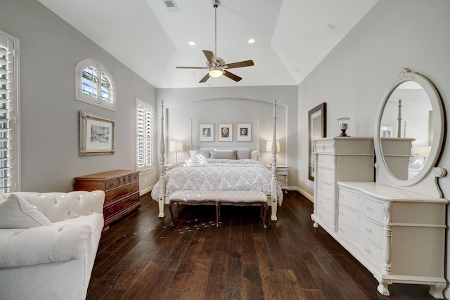 bedroom with ceiling fan, dark wood-type flooring, and vaulted ceiling