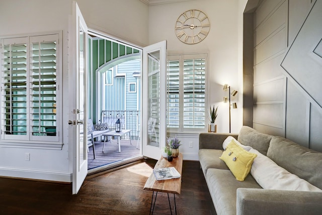 living room featuring dark hardwood / wood-style floors and crown molding