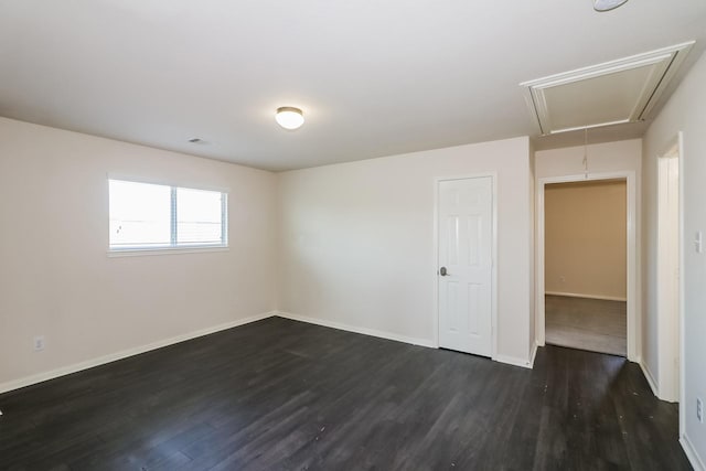 unfurnished room featuring dark hardwood / wood-style flooring