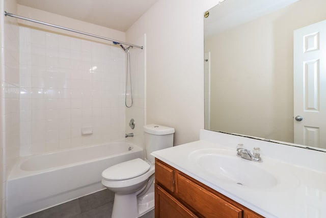 full bathroom featuring toilet, vanity,  shower combination, and tile patterned floors