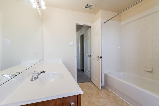 bathroom with tile patterned flooring, vanity, and shower / bath combination