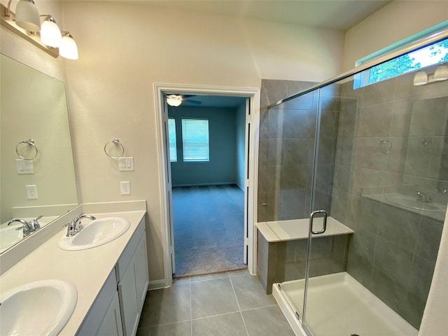 bathroom with tile patterned flooring, vanity, and an enclosed shower