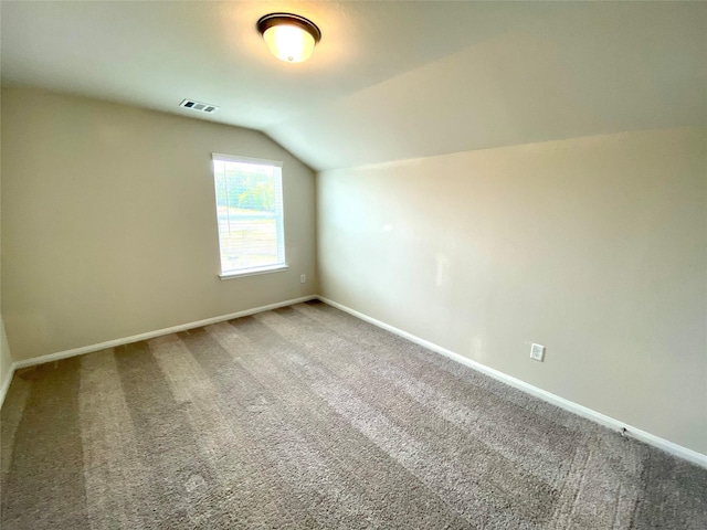 bonus room with carpet and lofted ceiling