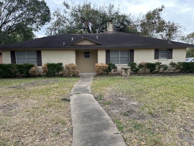 ranch-style home featuring a front yard