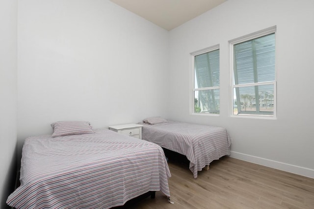 bedroom with light hardwood / wood-style floors