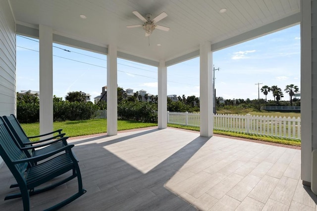 exterior space with ceiling fan