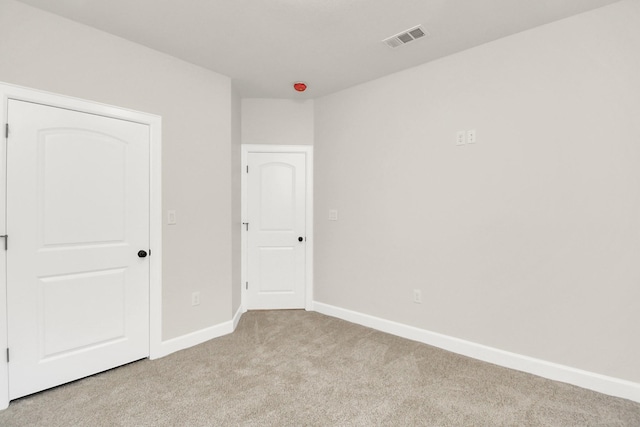 unfurnished bedroom with light carpet