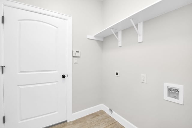 washroom with hookup for an electric dryer, washer hookup, and light hardwood / wood-style floors