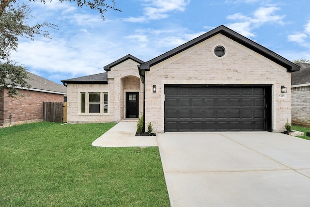 view of front of house with a front lawn and a garage