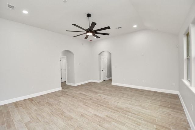 empty room featuring ceiling fan, light hardwood / wood-style floors, and lofted ceiling