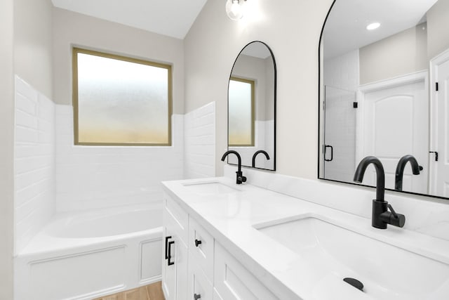 bathroom with vanity and plus walk in shower