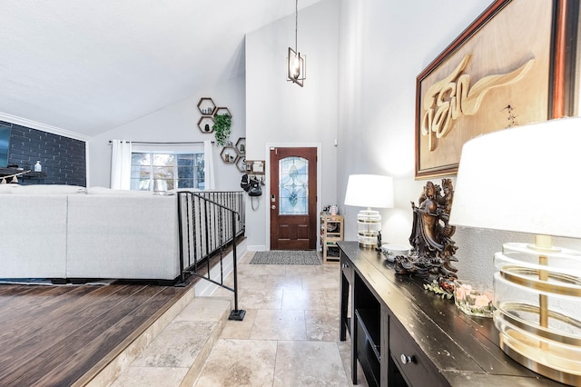 foyer featuring light hardwood / wood-style floors and lofted ceiling